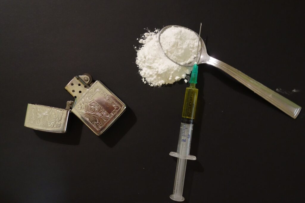 a-syringe-and-powdered-heroin-with-paraphernalia