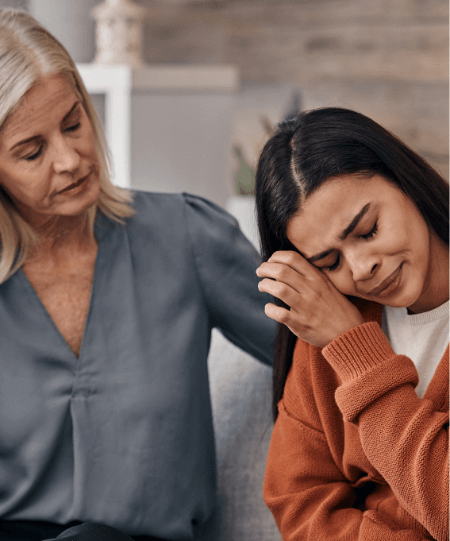 Therapist consoling Hispanic female patient