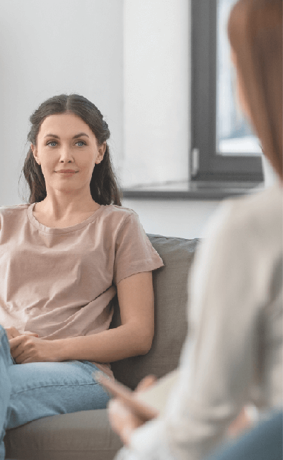 Woman looking at a therapist during a free mental health assessment