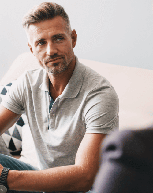 Man listening to a therapist at a substance use disorder facility