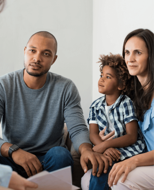 Parents and their young son attending family therapy